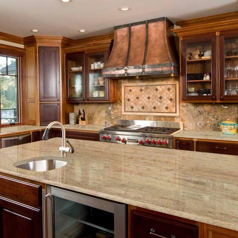 Light brown cabinets with black granite