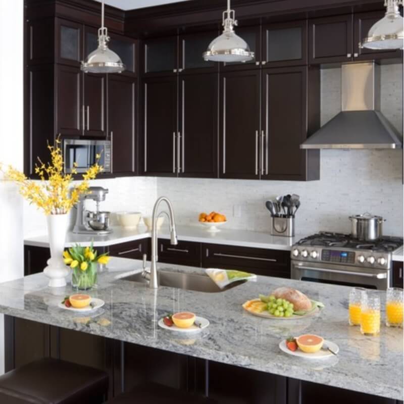 grey granite countertops with brown cabinets