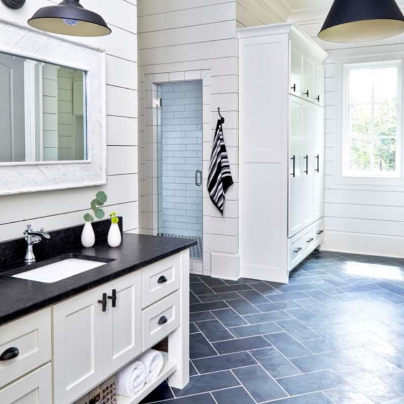 white bathroom cabinets with dark countertops