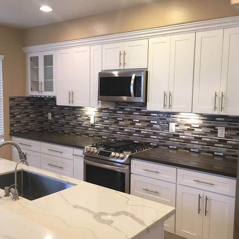 Installing stainless steel kitchen backsplash!