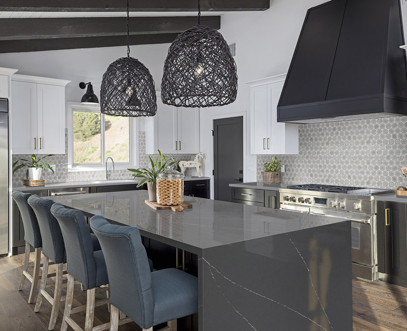 Updated kitchen with gray waterfall countertop