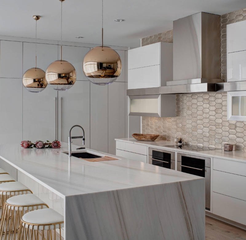 Waterfall Islands With Book Matched Quartz Countertops