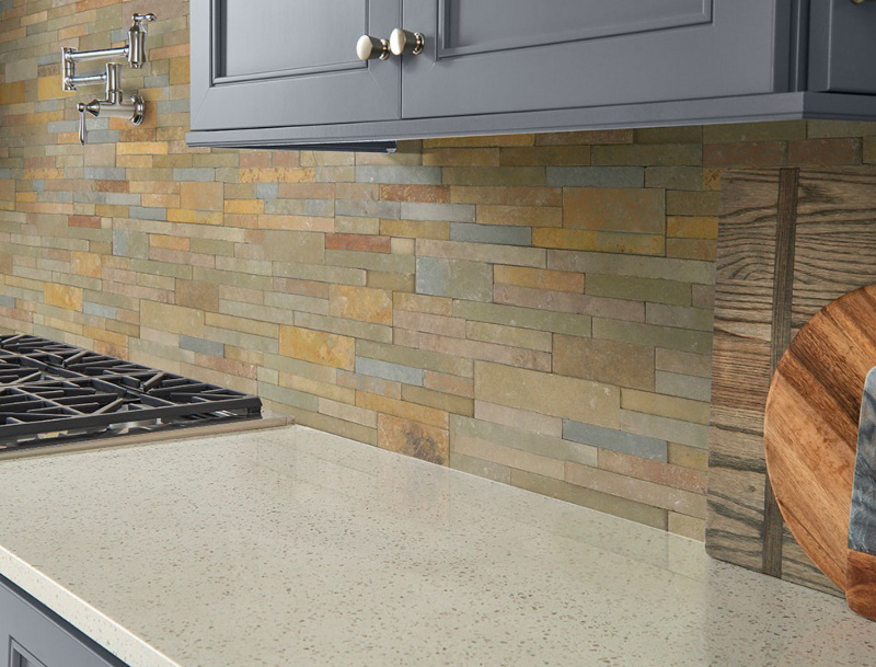 multi colored stacked stone kitchen backsplash