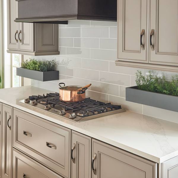 quartz countertop with subway tile backsplash