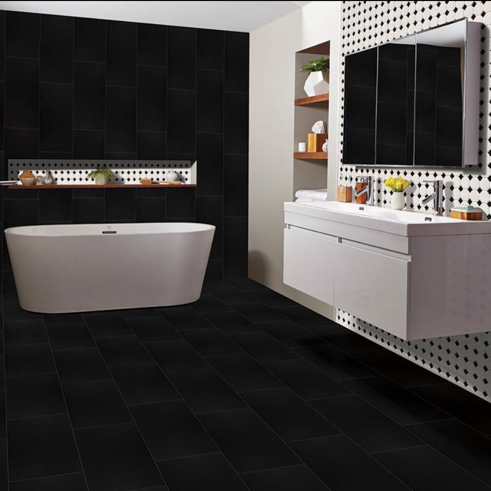 dramatic porcelain tile bathroom with black and white tile