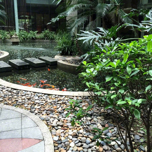 outdoor water feature with pebble path