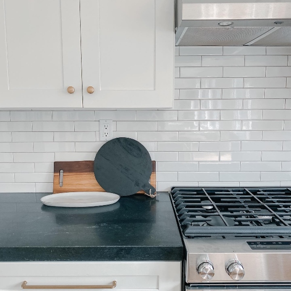 black granite counter in white kitchen