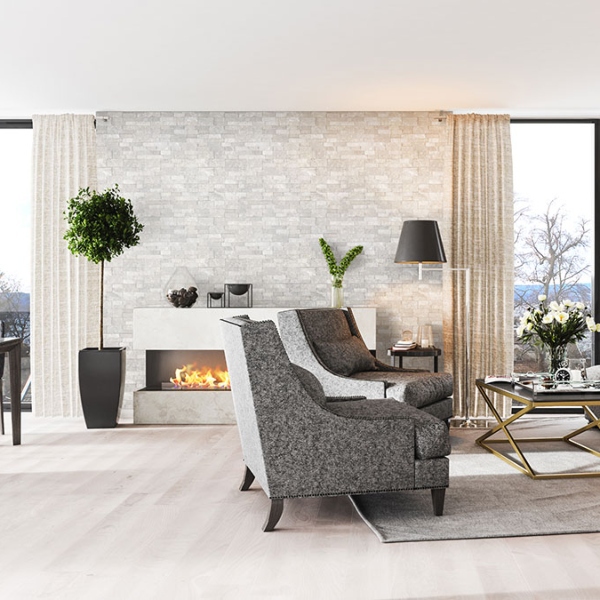 white and silver stacked stone fireplace in loft