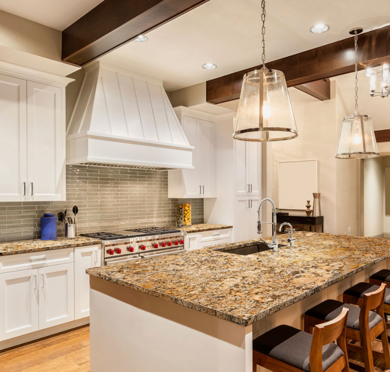 Beige granite countertops with white cabinets