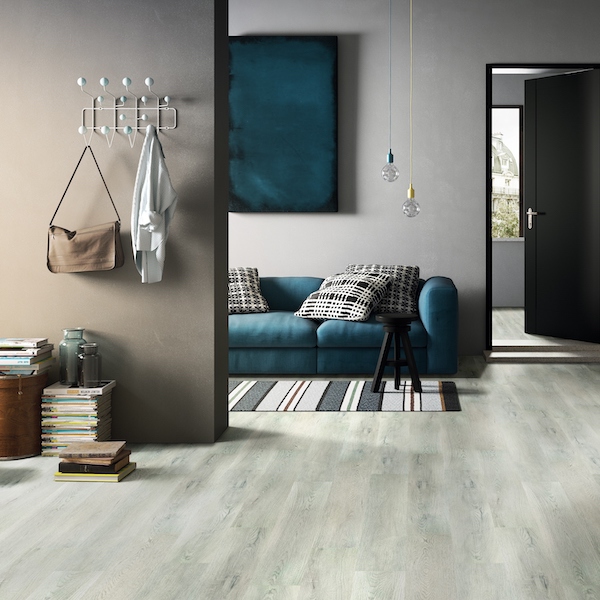 https://cdn.msisurfaces.com/images/blogs/posts/2021/11/msi-kardigan-vinyl-flooring-in-blue-smoke-grey-in-modern-loft.jpg