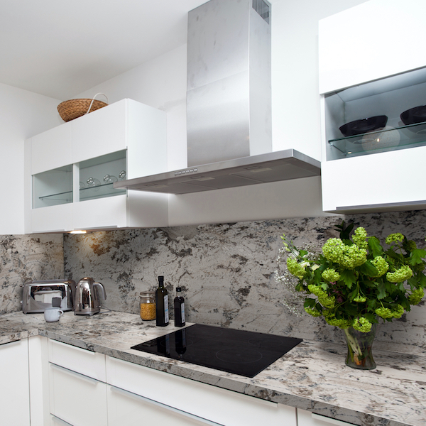 msi-grey-nuevo-swirled-white-granite-counter-with-modern-white-cabinets