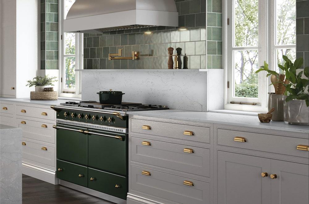msi-calacatta-lavasa-quartz-kitchen-counter-with-green-stove-and-gold-accents-min