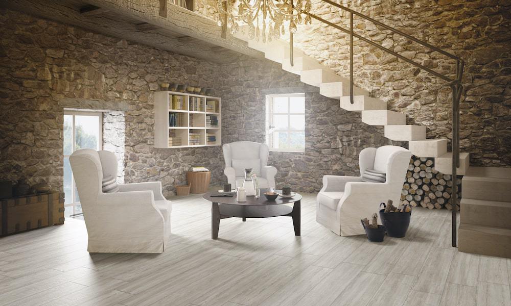 https://cdn.msisurfaces.com/images/blogs/posts/2023/04/msi-grigia-caldera-porcelain-plank-wood-floor-in-stone-wall-living-room-min.jpg