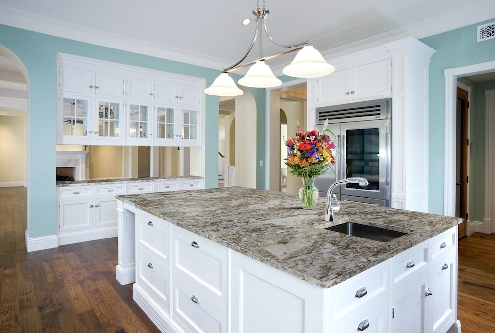 msi-desert-sand-granite-kitchen-counter-with-farmhouse-white-cabinets-min