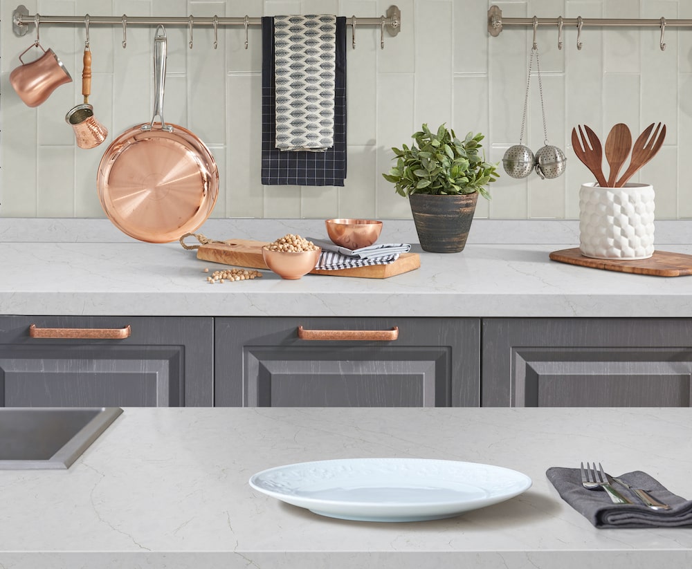 msi-calacatta-karmelo-quartz-kitchen-counter-with-grey-cabinets-min