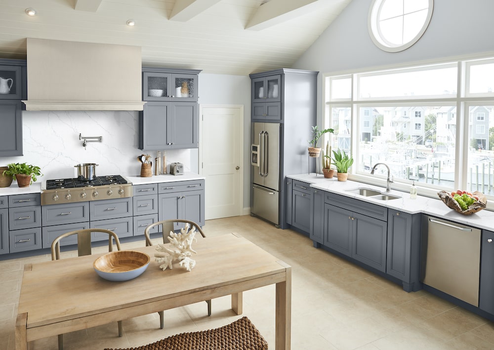 msi-calacatta-miraggio-cielo-quartz-kitchen-counter-with-smokey-blue-cabinets-min