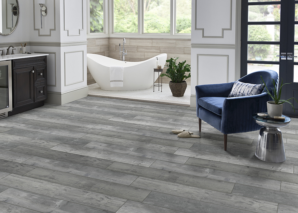 https://cdn.msisurfaces.com/images/blogs/posts/2023/11/andover-kingsdown-gray-lvp-rigid-core-flooring.jpg