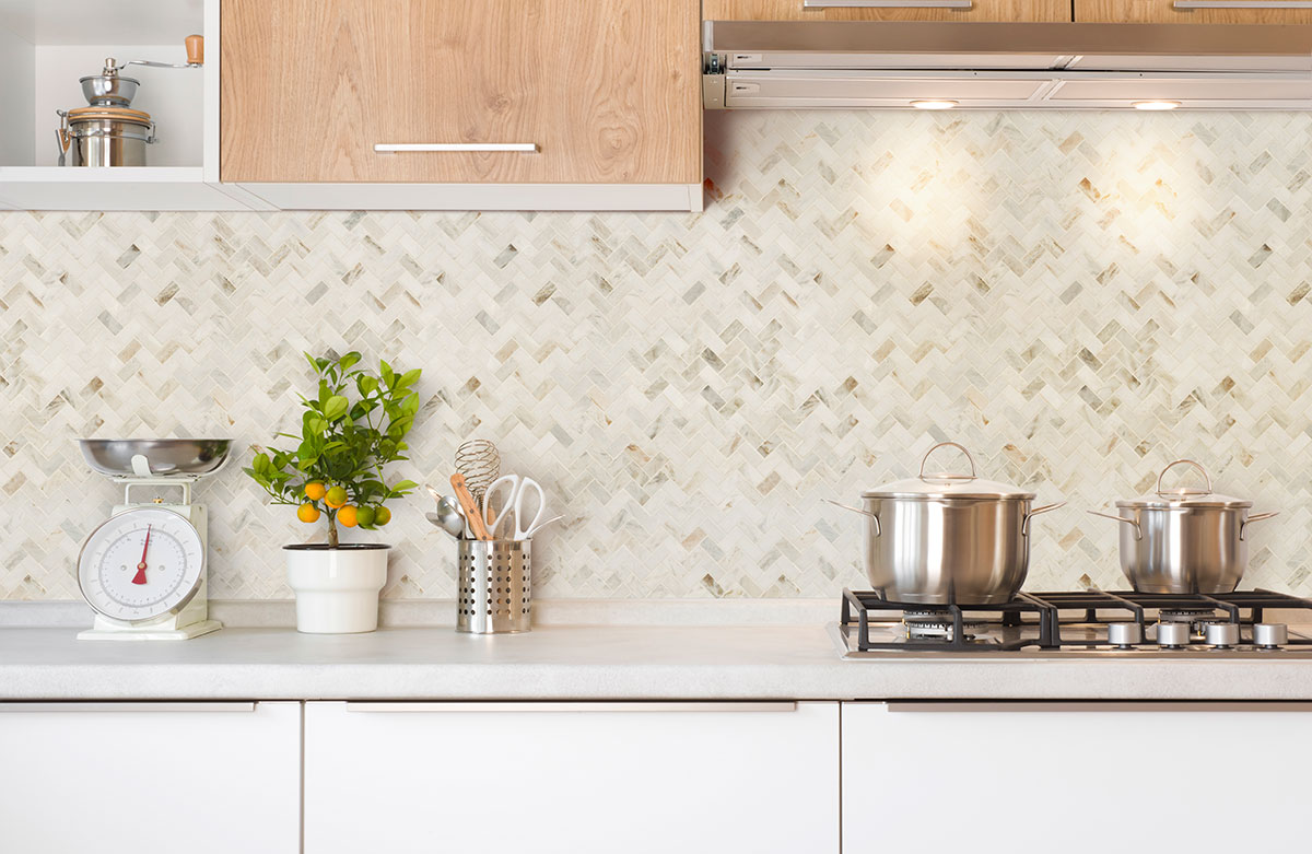msi-arabescato-venato-white-herringbone-tile-in-kitchen-backsplash