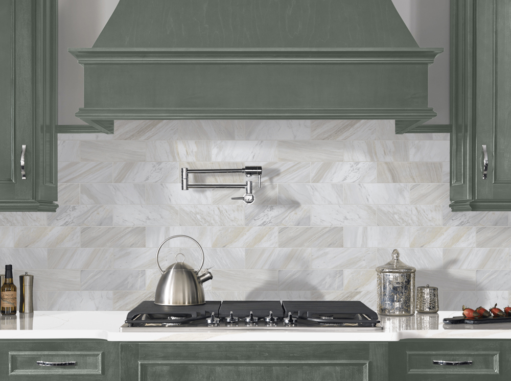 calacatta-leon-gold-athena-gold-4x12-tile-dark-green-cabinets