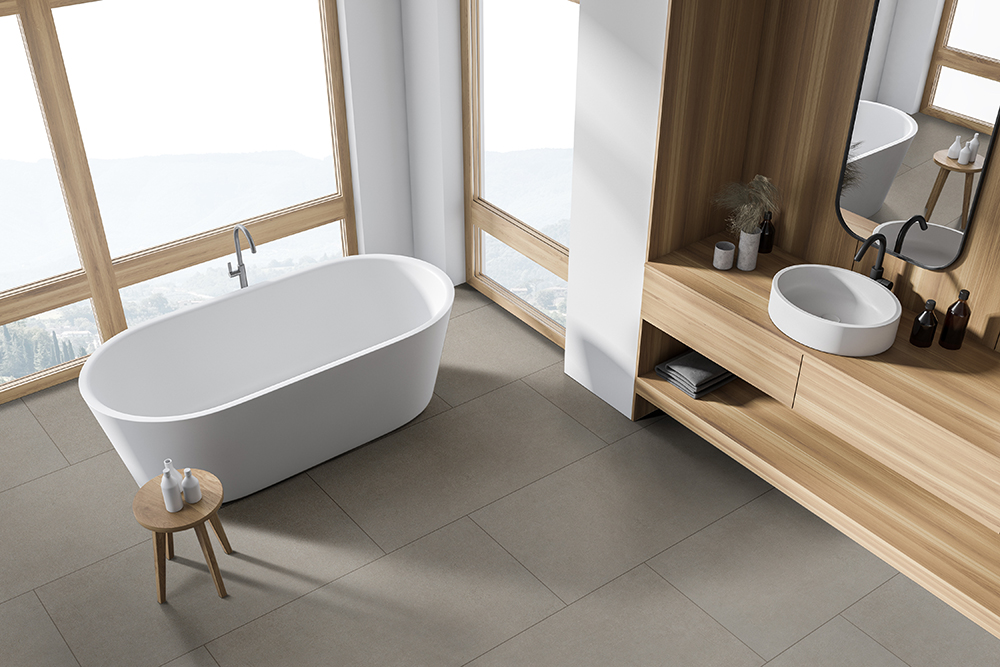 Contemporary bathroom with large format matte porcelain tile flooring in wet areas for slip resistance.
