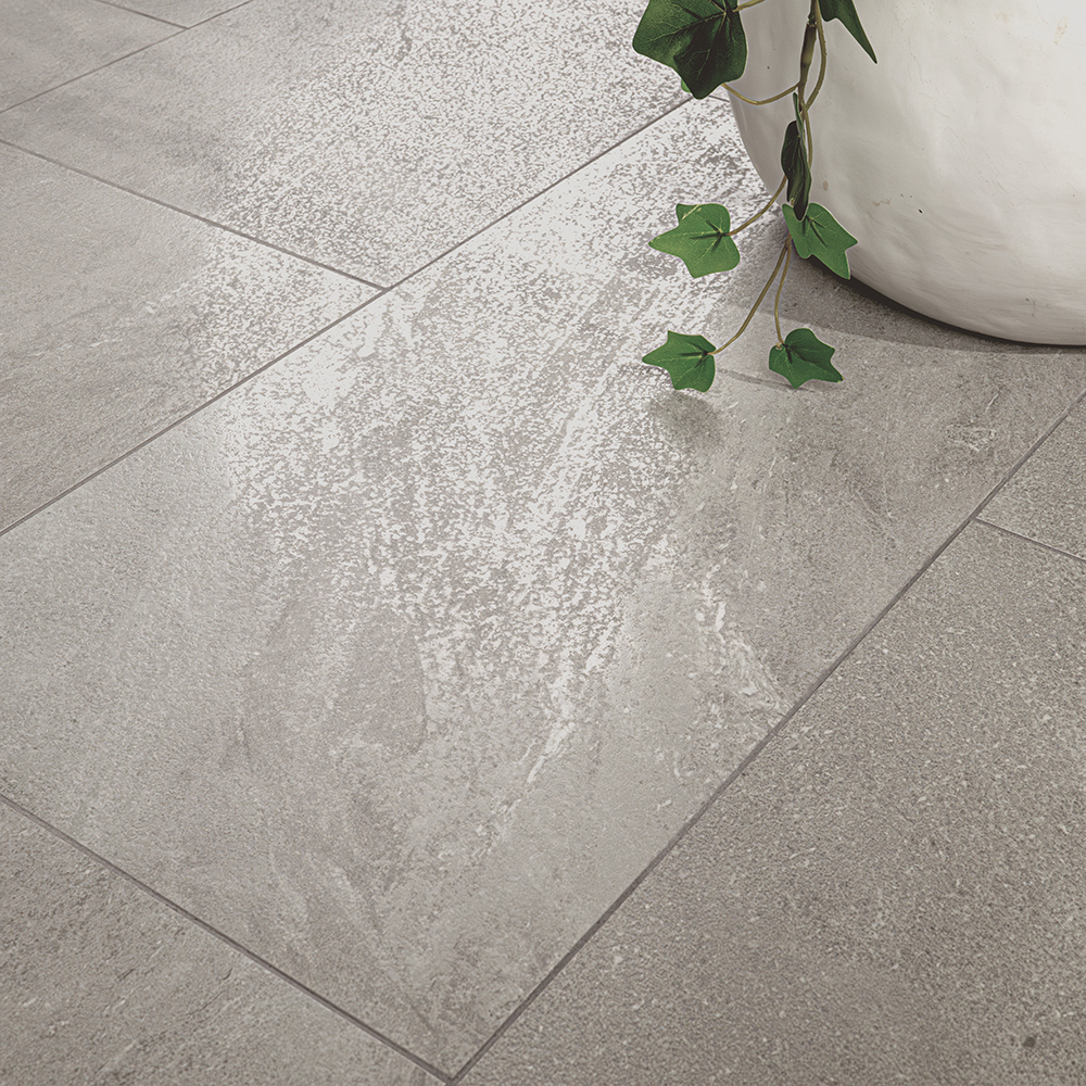 Close-up image of the surface of a matte porcelain tile, displaying the texture and finish of polished vs matte porcelain tile for use in high-traffic flooring applications.