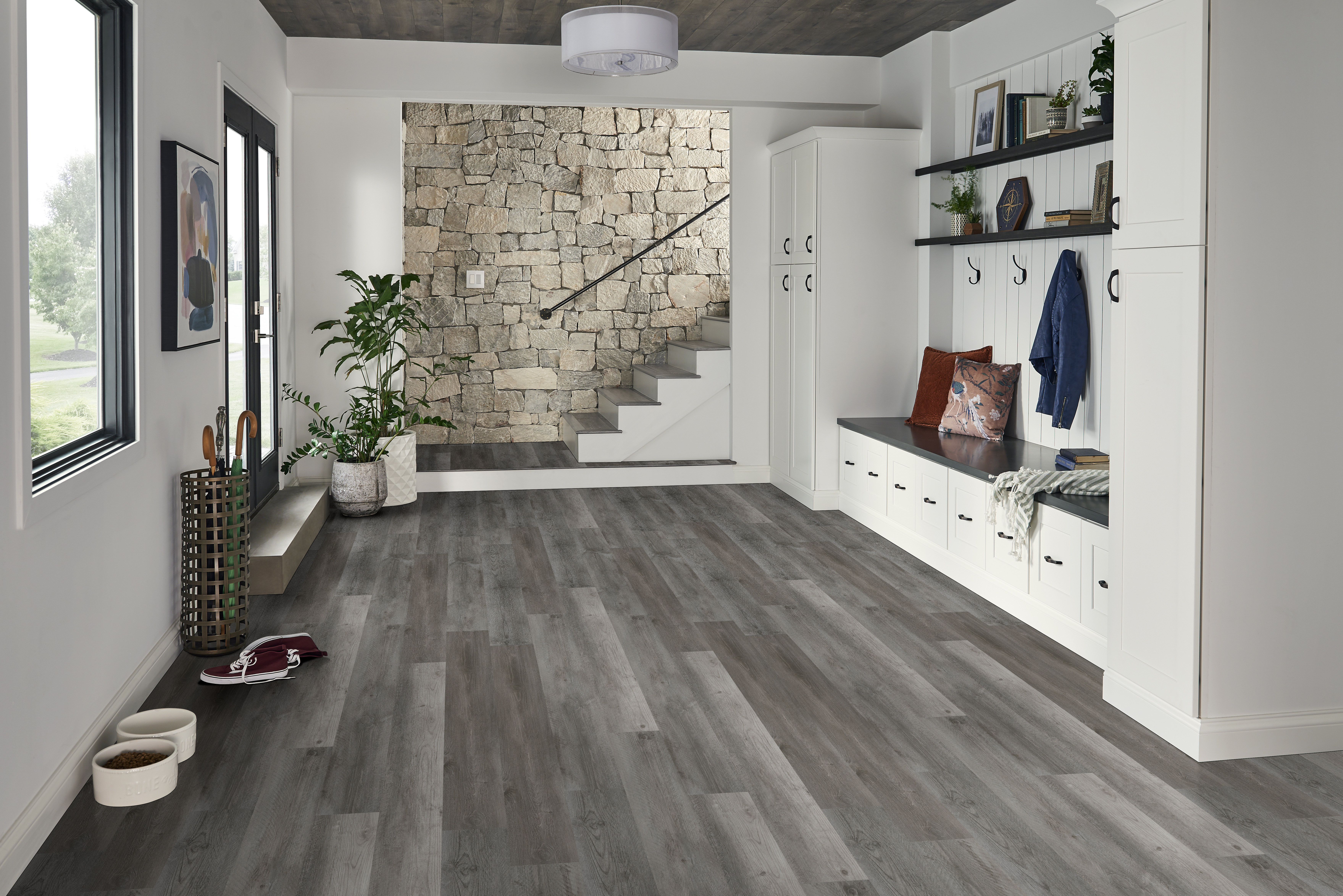 Contemporary interior with gray vinyl plank flooring showcasing the benefits of LVP flooring for large open spaces and modern design.