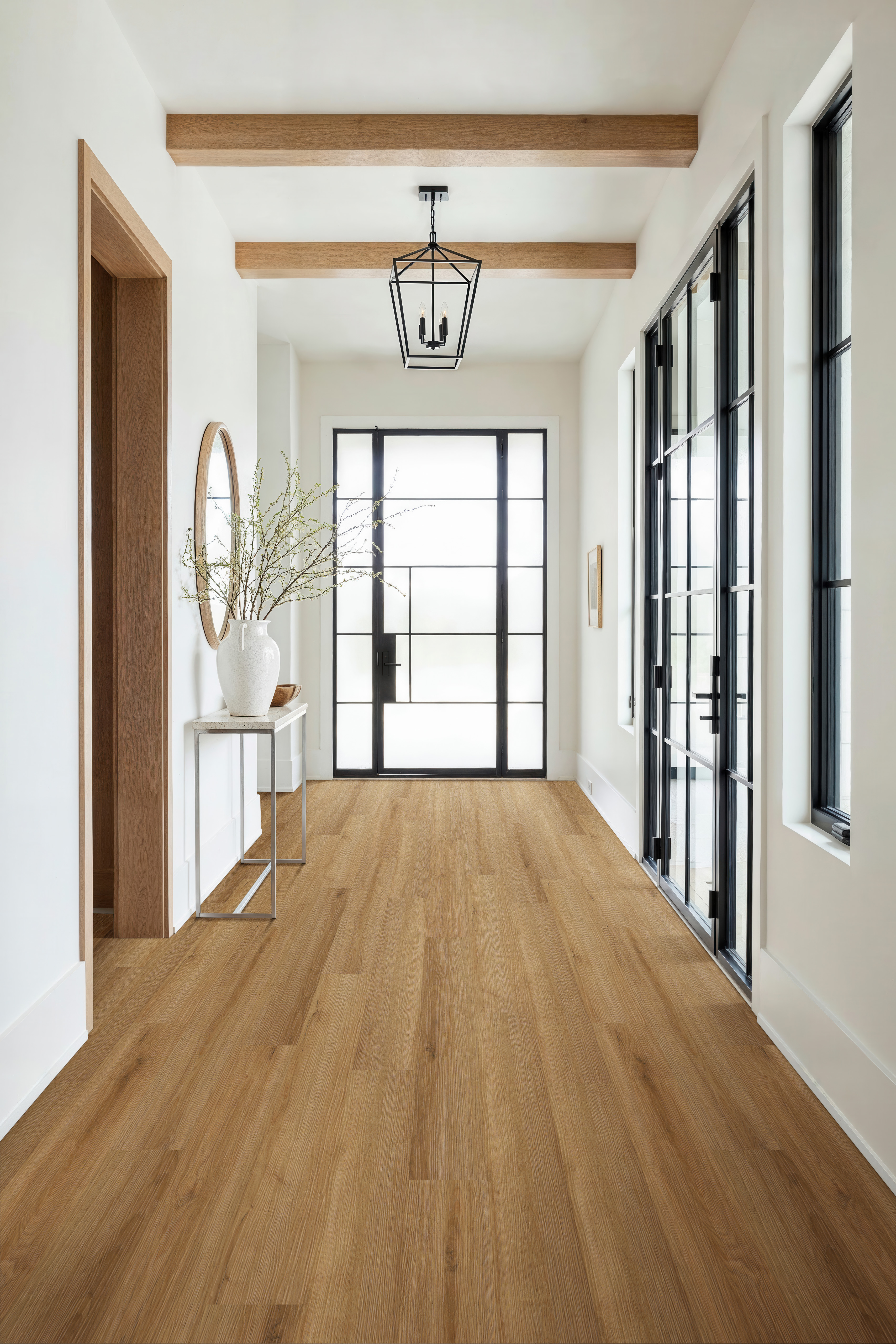 Modern hallway with wood-look vinyl plank flooring, highlighting the benefits of vinyl plank flooring for durability and style.