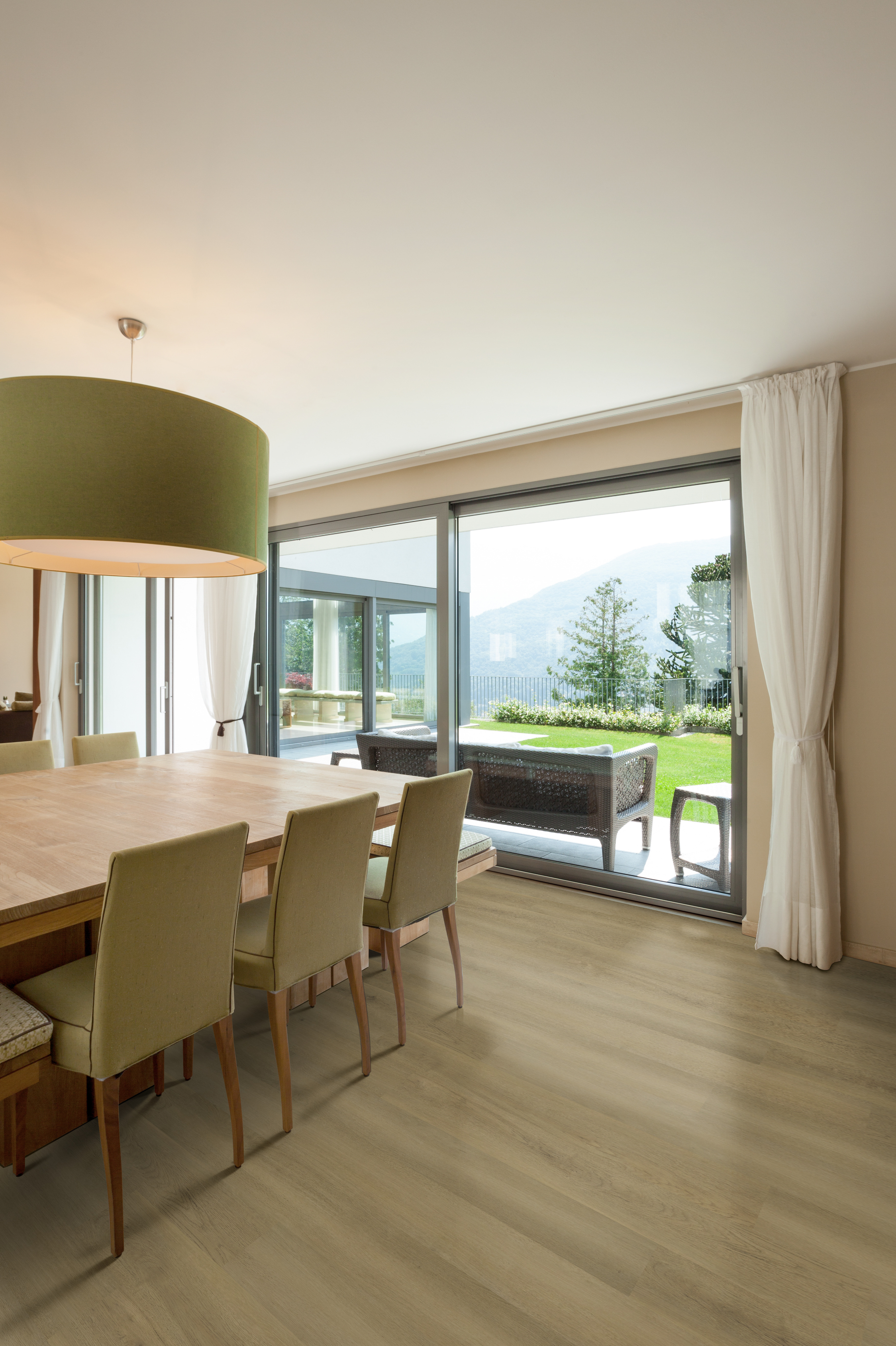 Dining room featuring realistic wood-look vinyl plank flooring, illustrating the benefits of LVP flooring for comfort and easy maintenance.