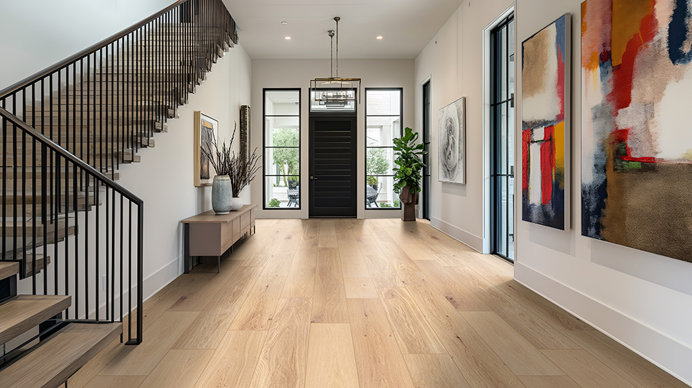 Modern entryway with wide planks of engineered hardwood flooring &mdash; benefits of engineered vs solid hardwood for lasting value.