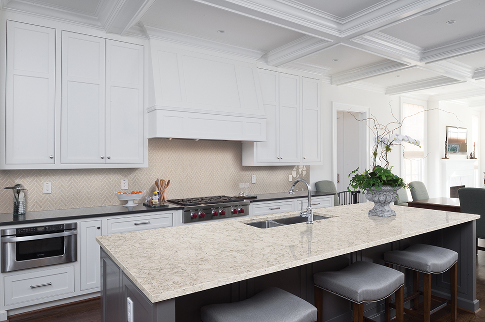 Light-colored quartz countertop island in a bright kitchen, highlighting neutral quartz countertop color trends for 2026.
