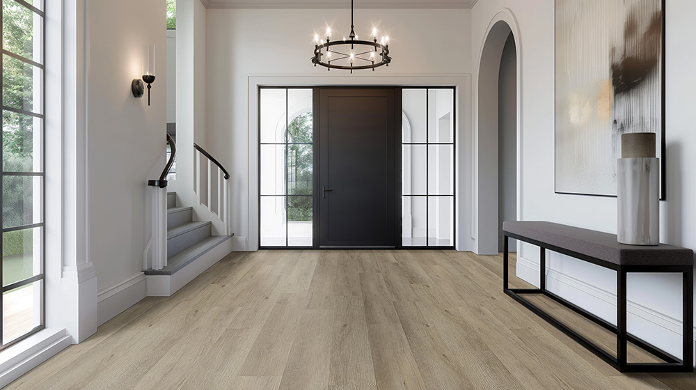 Contemporary entryway with a light wood look LVT floor that exemplifies the longevity provided by the right thickness of the LVT wear layer thickness.