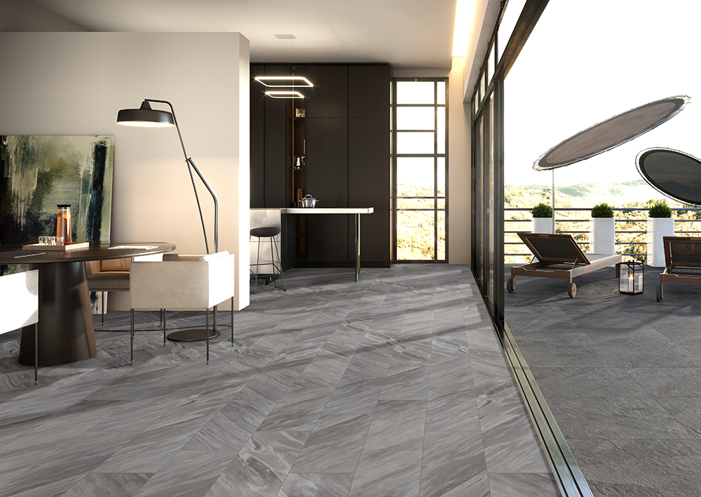 Large format porcelain tile that transitions from an indoor living space to an outside patio for a smooth flow.