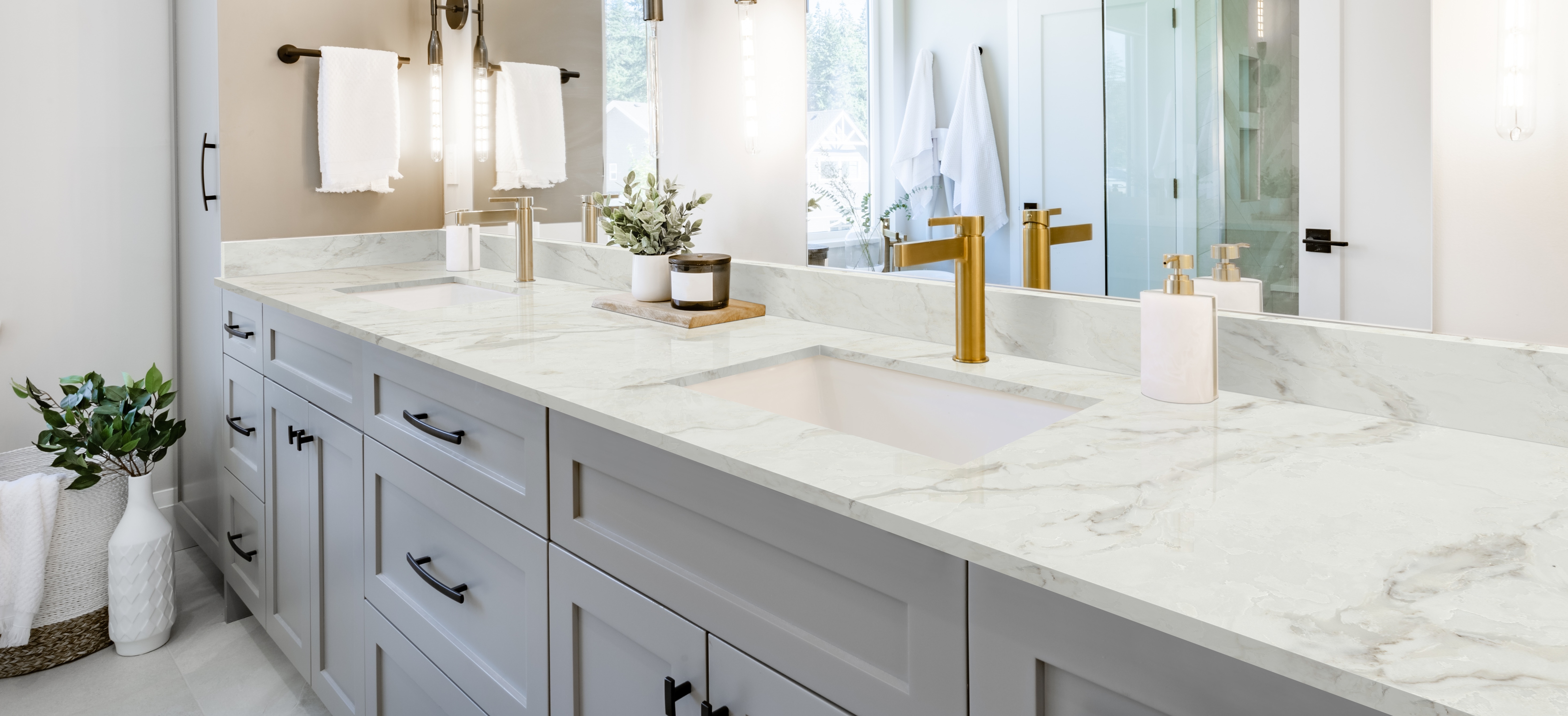 Bright bathroom vanity with natural stone counters, illustrating why does my countertop look different than the photo?