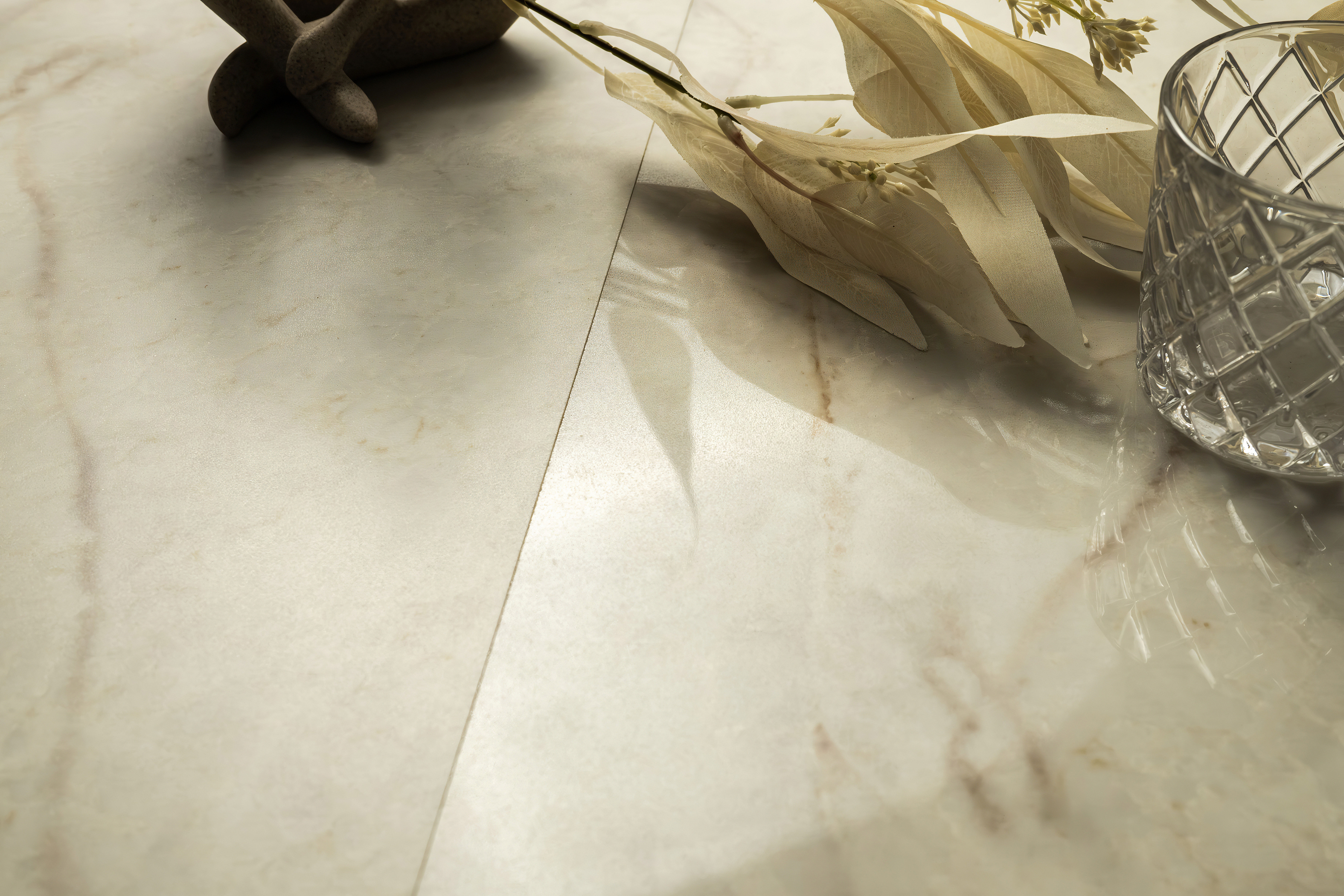 A close view of a polished natural stone surface illustrating how reflections and lighting answer the question, why does my countertop look different than the photo?
