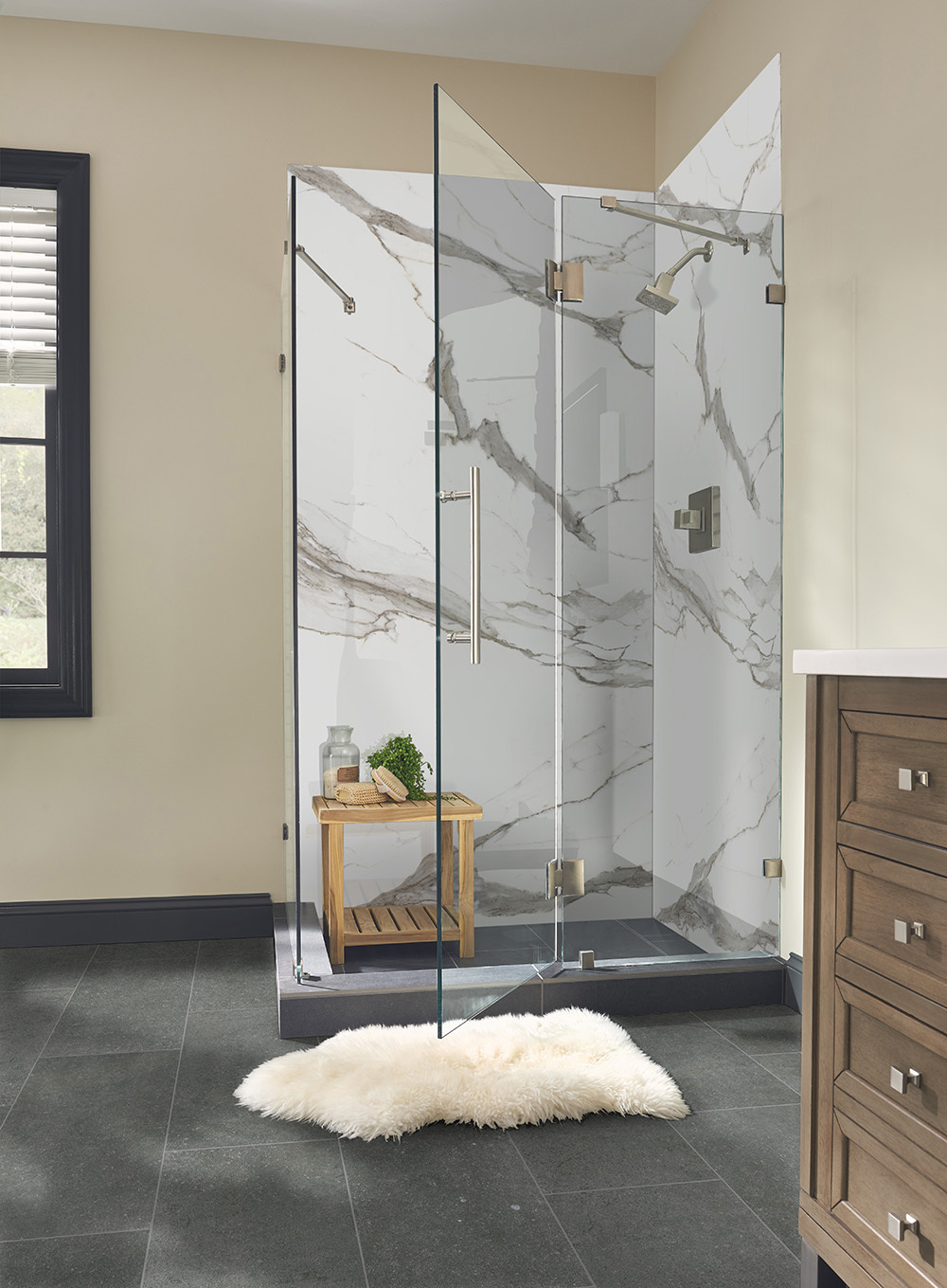 Walk-in shower with full height porcelain slab walls, showing porcelain slab thickness for shower installations.