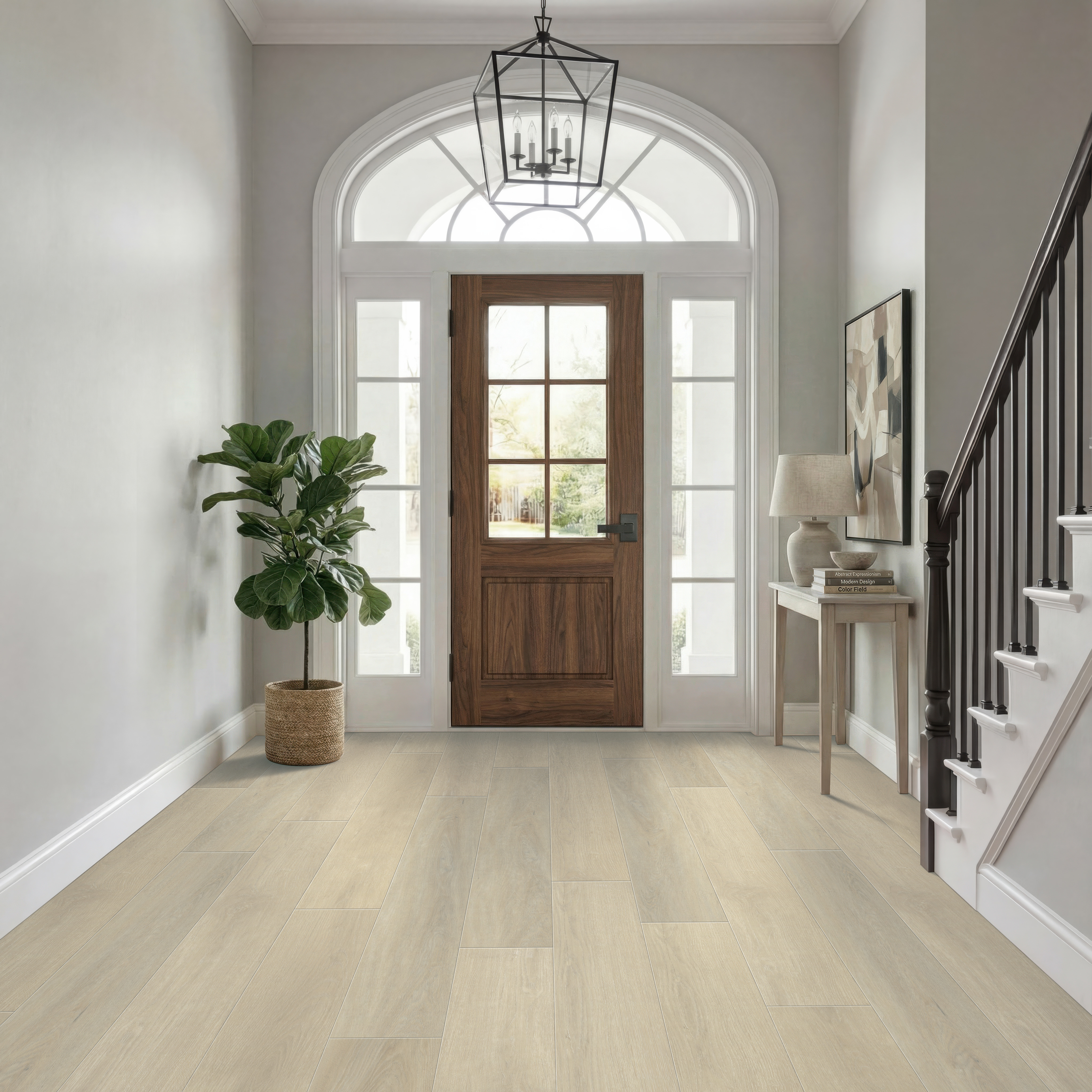 Light oak-look hybrid rigid core flooring in a residential entryway designed for everyday foot traffic.