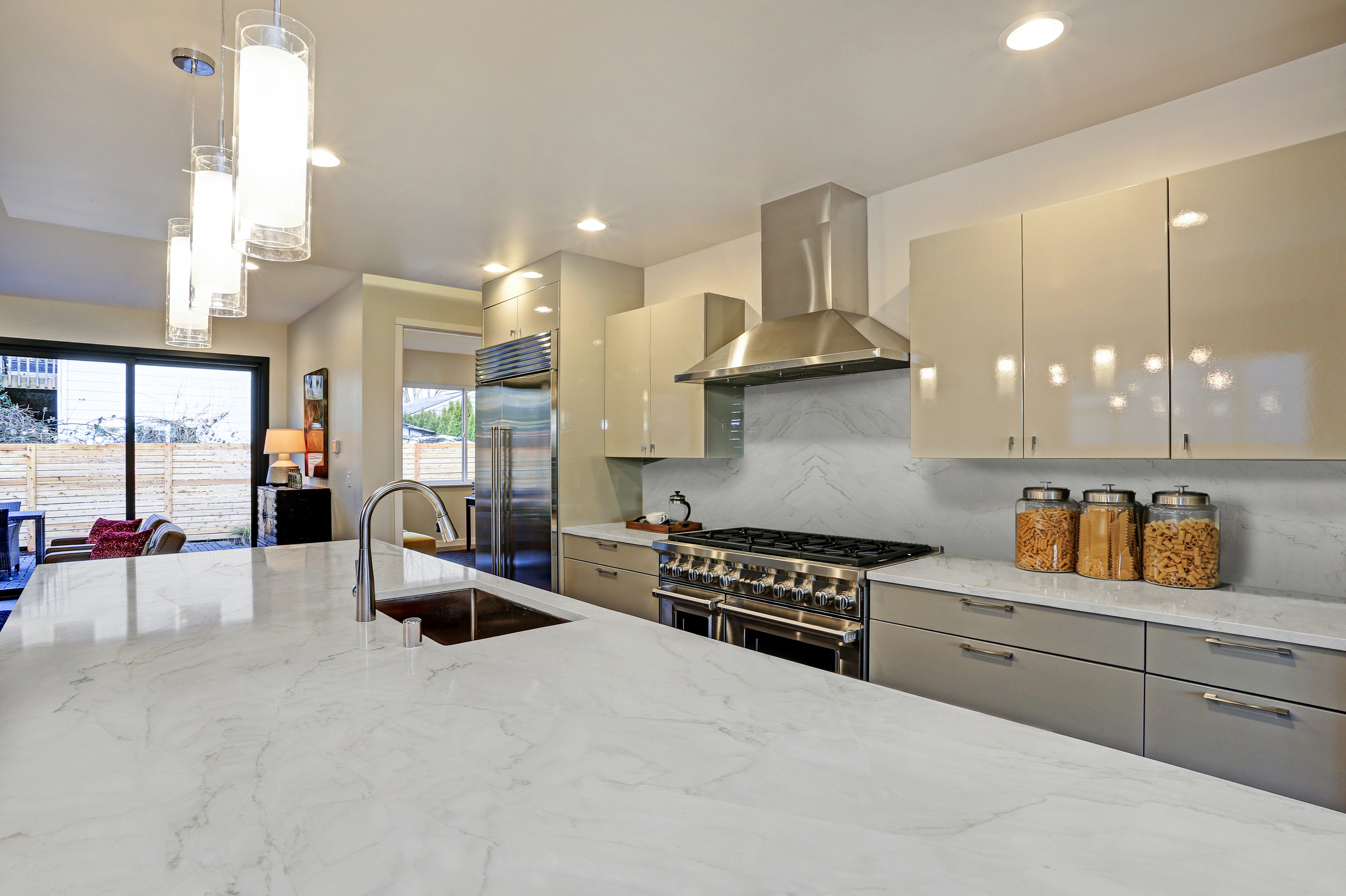 Calacatta Montreal Quartzite countertops with soft gray veining in a modern kitchen, showcasing a durable natural stone surface.