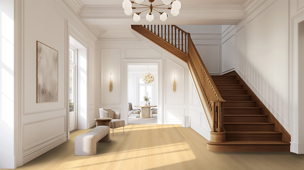 Stylish foyer with light wood-look flooring, emphasizing timeless flooring trends 2026 for homes.