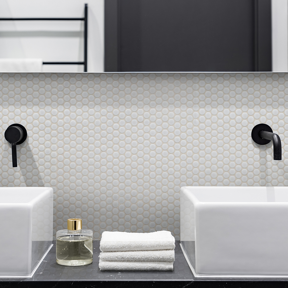 White penny round mosaic tile backsplash behind dual sinks, showcasing what is mosaic tile and its detailed pattern.