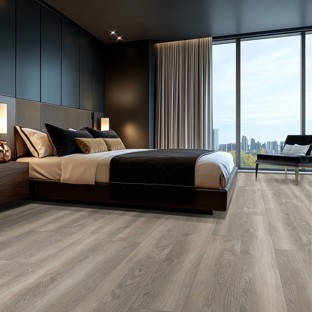Gray wood-look hybrid rigid core flooring in a contemporary bedroom with floor-to-ceiling windows.