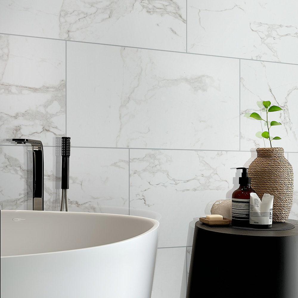 Marble-look porcelain tile with subtle veining, showcasing a durable surface for bathroom floors and wet areas.