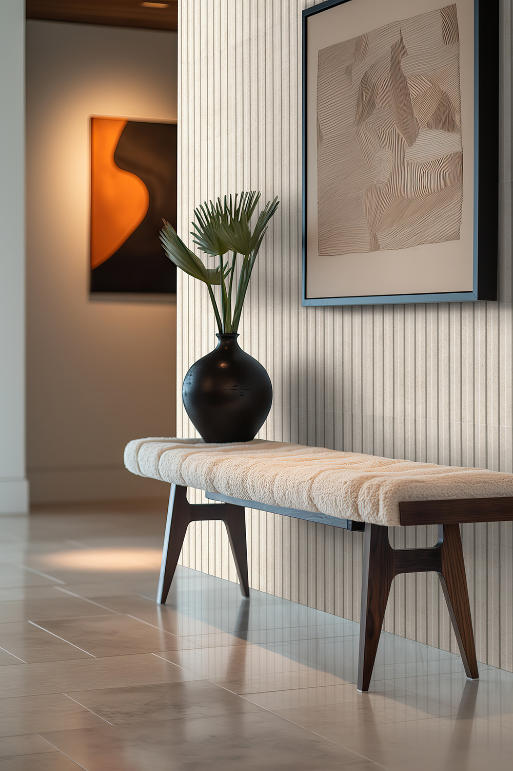 Modern entryway with bench and decorative artwork, white fluted tile accent wall with vertical details.