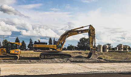 Two bulldozers in operation at a construction site