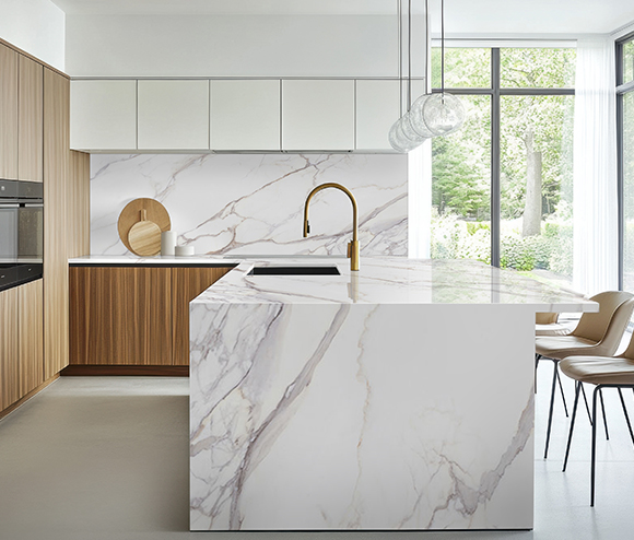 Modern kitchen with Stile large format porcelain slabs in marble look design.
