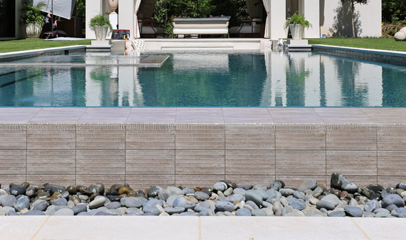 Gems Grigio Fluted Tile used as waterline pool tile