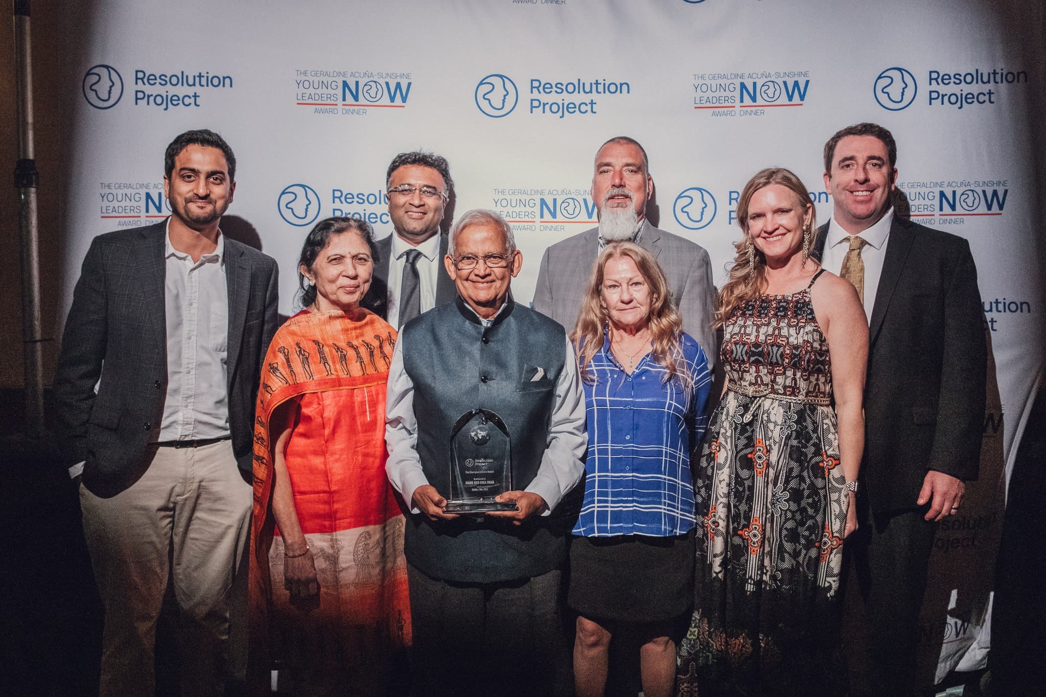 Group of individuals being recognized with an award by the Resolution Project