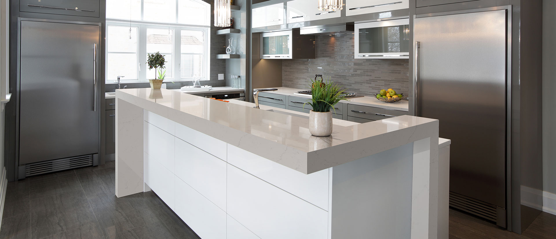Alabaster white quartz countertop in a well-lit kitchen