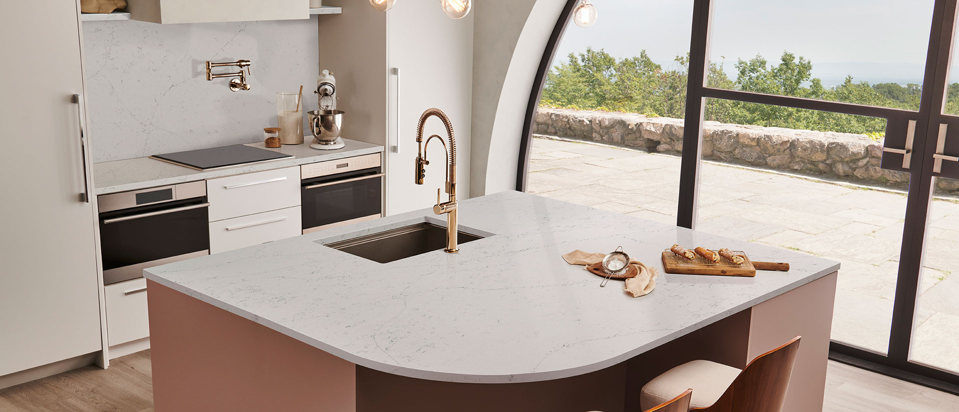Calacatta Botanica quartz countertop in a contemporary kitchen with wooden cabinets