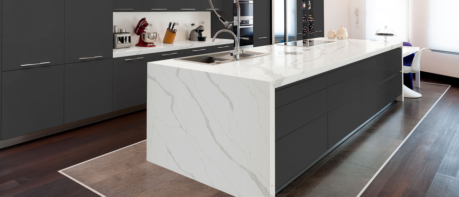 Calacatta Izaro quartz countertop in a luxurious kitchen with golden accents