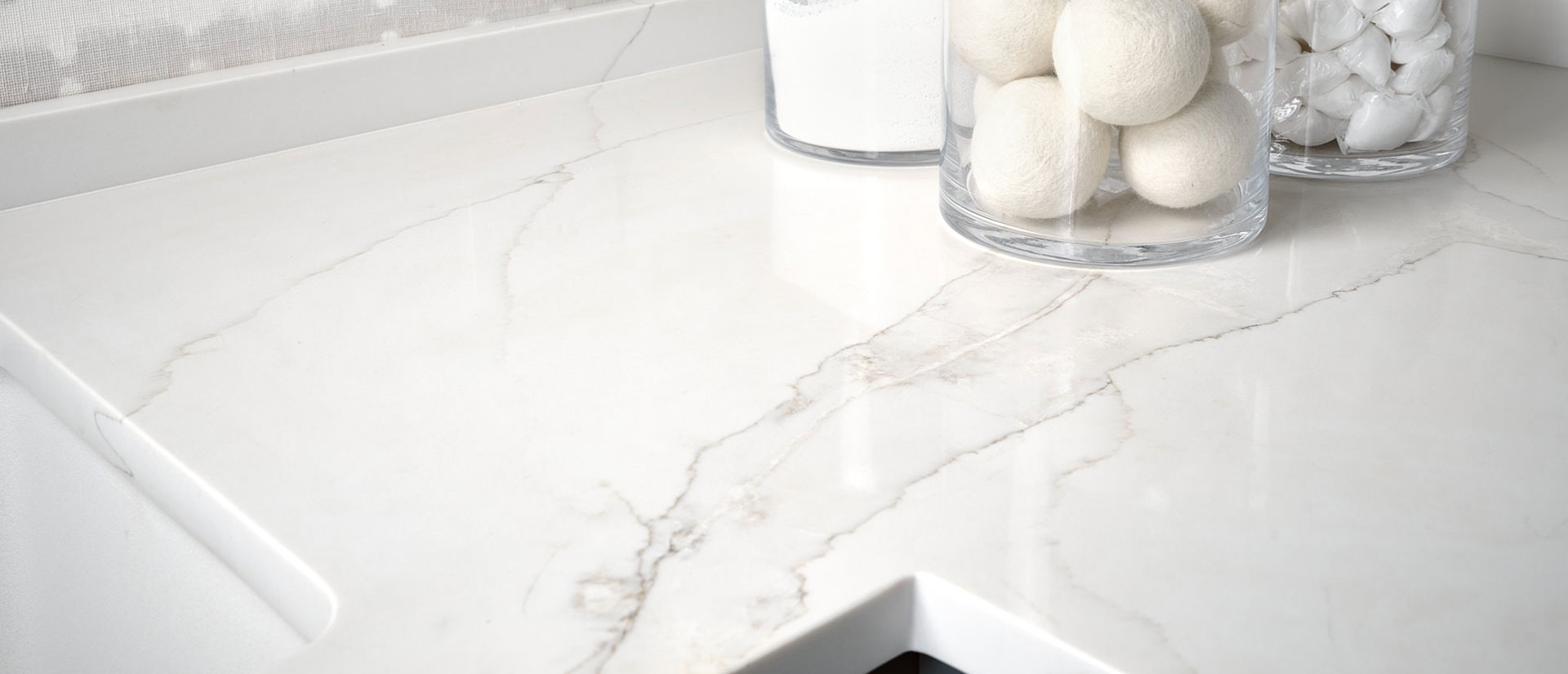 Calacatta Izaro quartz countertop in a luxurious kitchen with marble backsplash